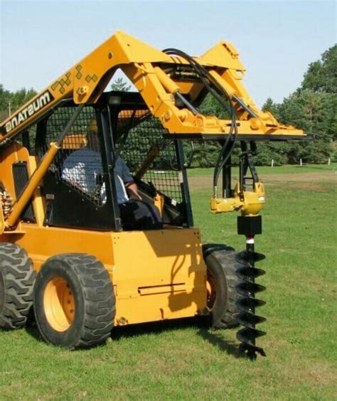 digging with skid steer|post hole digger for excavator.